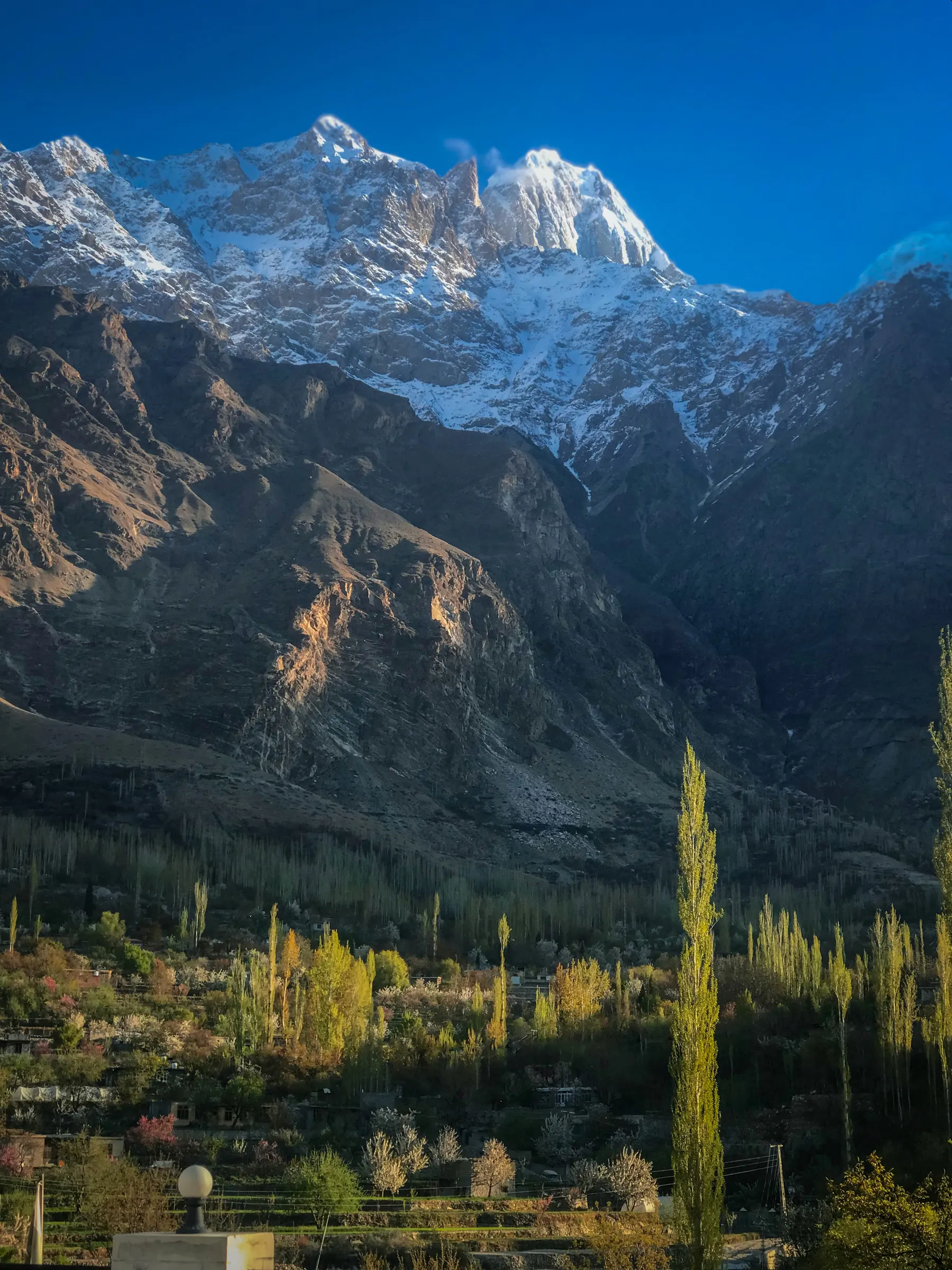 Hunza Valley with terraced fields and snow-capped Karakoram peaks, Gilgit-Baltistan